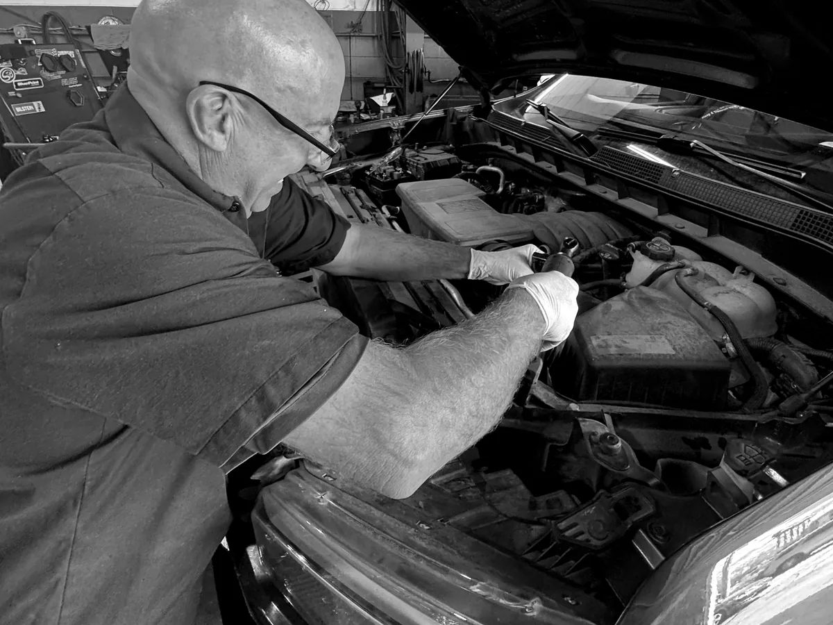 ATS Auto Repair Hammond technician performing under-hood repair